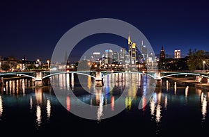 Frankfurt skyline and river Main at night photo